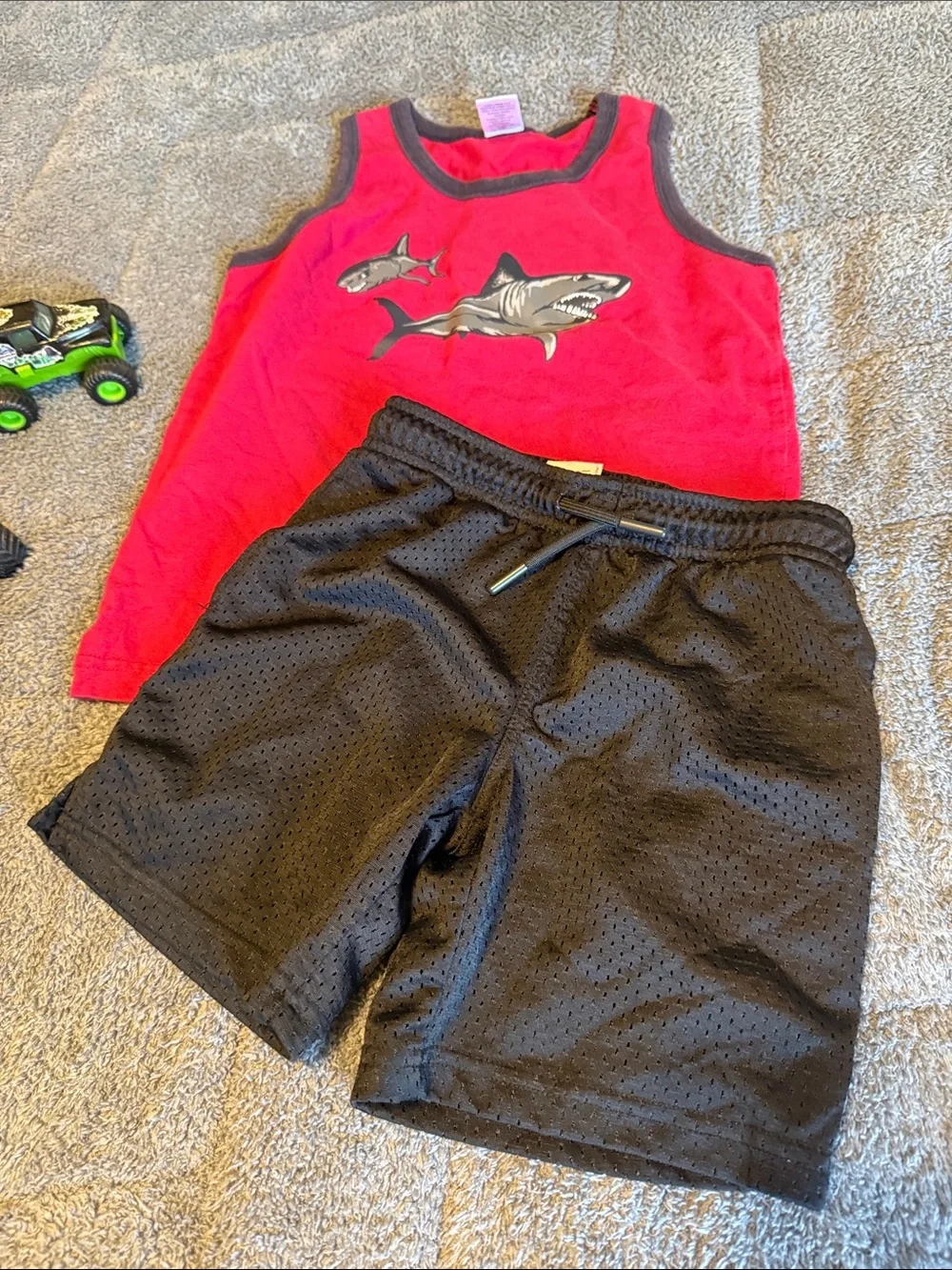 Red Shark Tank Top with Black Athletic Shorts
